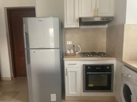 Sabina 1br apartment Lagoon view with shared pool By BFG Beit Fel Gouna — kitchen