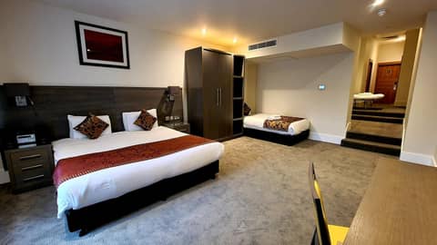 The Park City Grand Plaza Kensington Hotel — hotel room