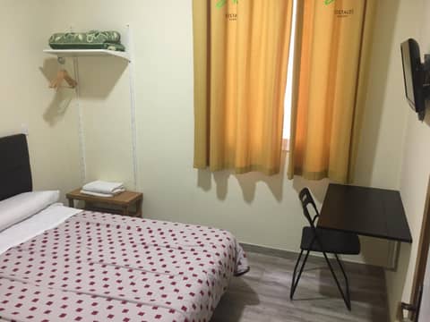 JQC Rooms — hotel room