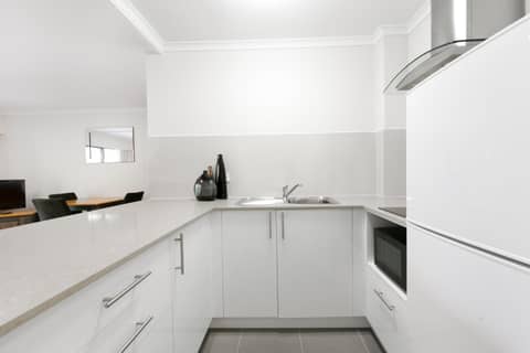 Mt Ommaney Hotel Apartments — kitchen