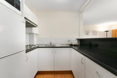 Mt Ommaney Hotel Apartments — kitchen