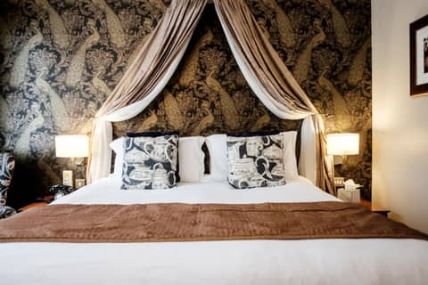 The Mad Hatter Hotel — hotel room