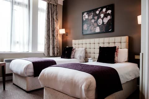 The Mad Hatter Hotel — hotel room