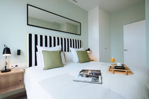 Sercotel Sevilla Guadalquivir Suites — bedroom